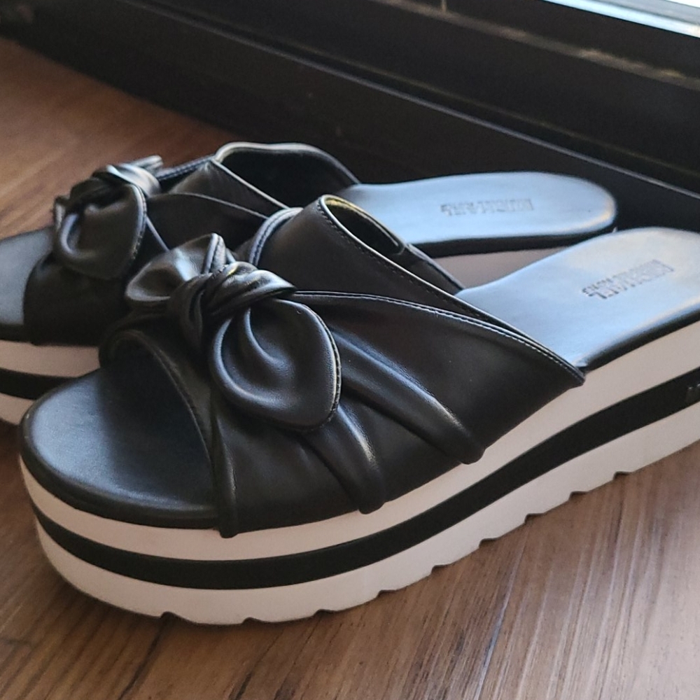Michael Kors Sporty platform slides.